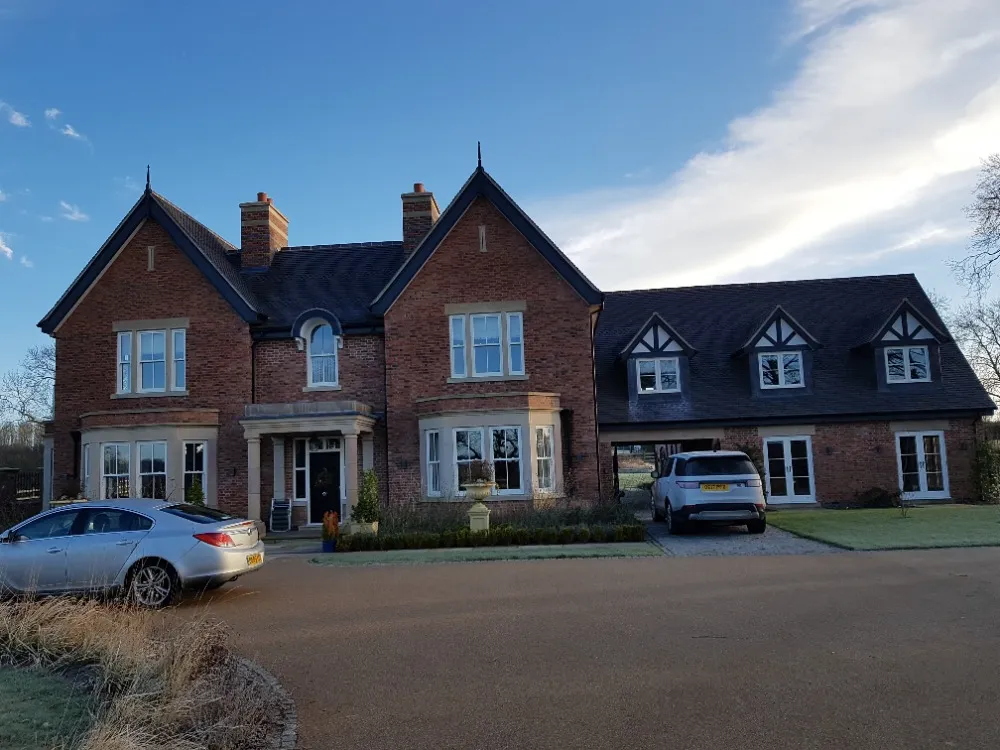 house with bay sliding sash windows